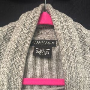 Well loved cardigan. Has stains on front and hole. Oops. Large wool.